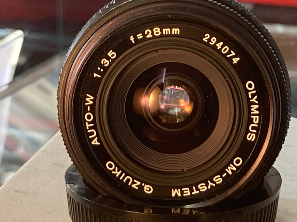 Olympus G.Zuiko Auto-W 28mm f/3.5 – frontglas