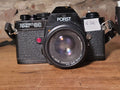 Porst Compact Reflex OC 35mm SLR camera met Porst Color Reflex MC Auto 50mm f/1.7 lens – vintage analoge camera bij De Majum Rotterdam